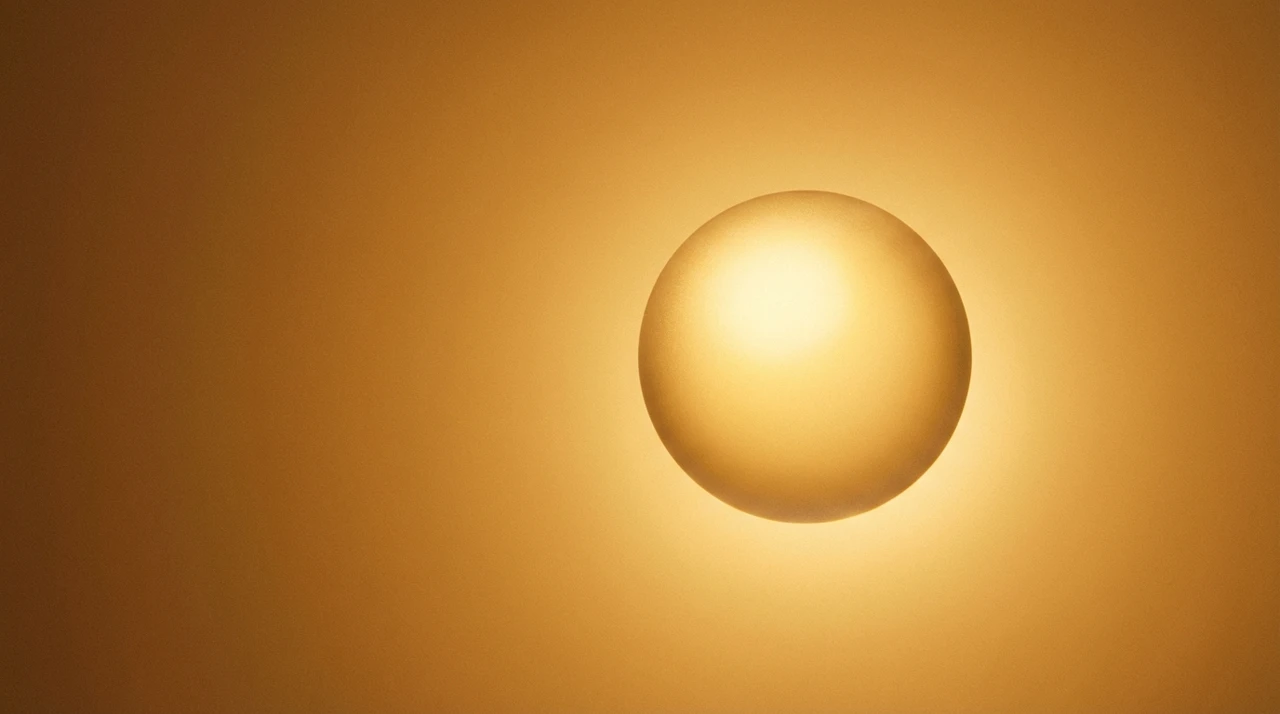 Warm amber gradient with a single luminous sphere, evoking the weight of a premium choice